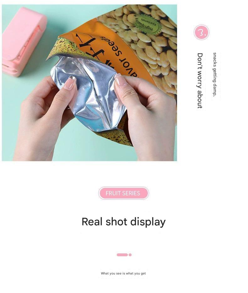 Hands opening a package of seeds with a pink device on a light blue background