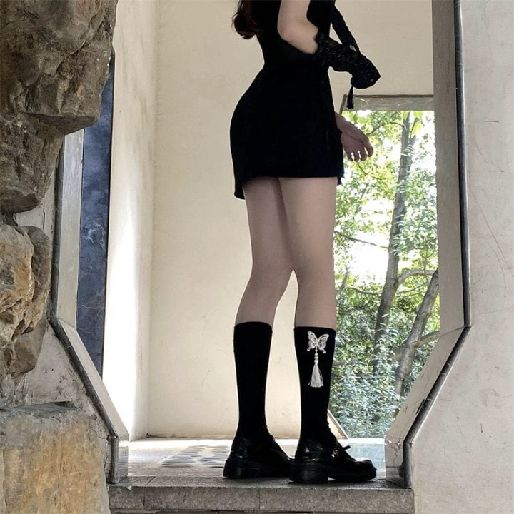 Fringed Embroidered Butterfly Calf Socks โ Black & White | Stylish Tassel Design