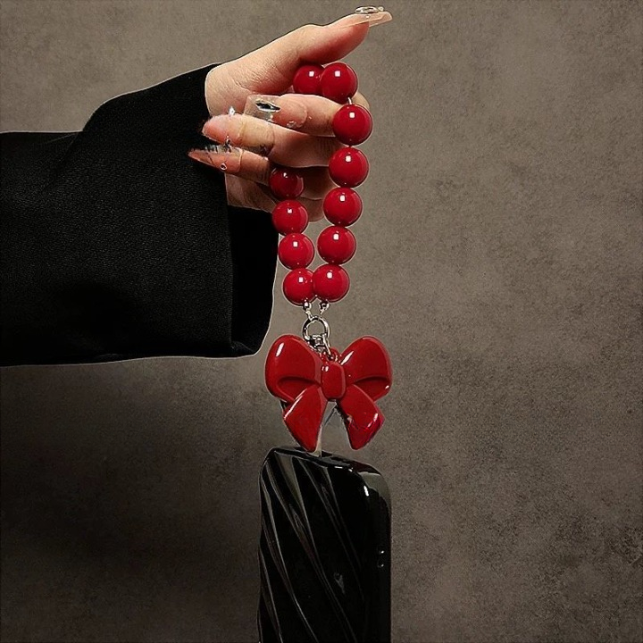 Luxury Black Phone Case with Red Bow Beaded Hand Strap – Stylish & Protective