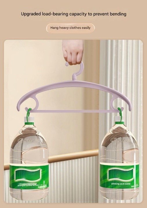 Purple hanger holding two bottles with a beige wall background