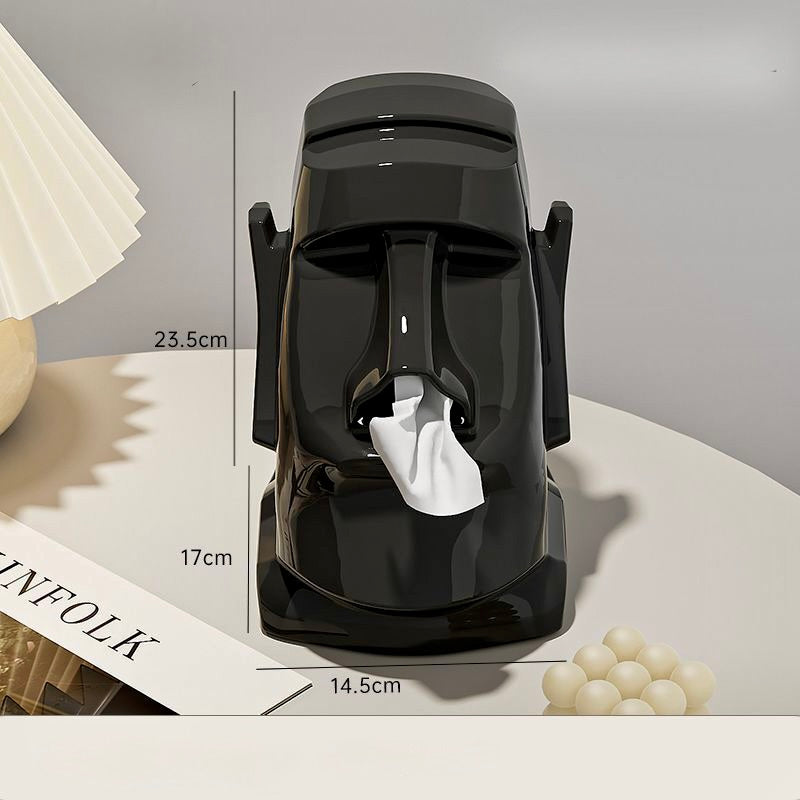Black face-shaped object with measurements on a neutral background