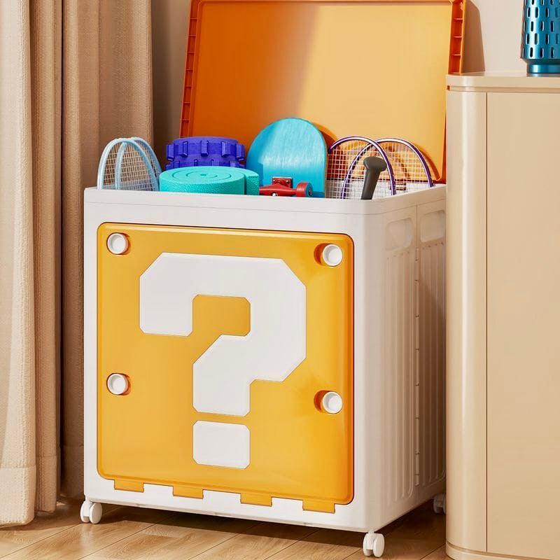 Toy storage box with question mark design on a wooden floor