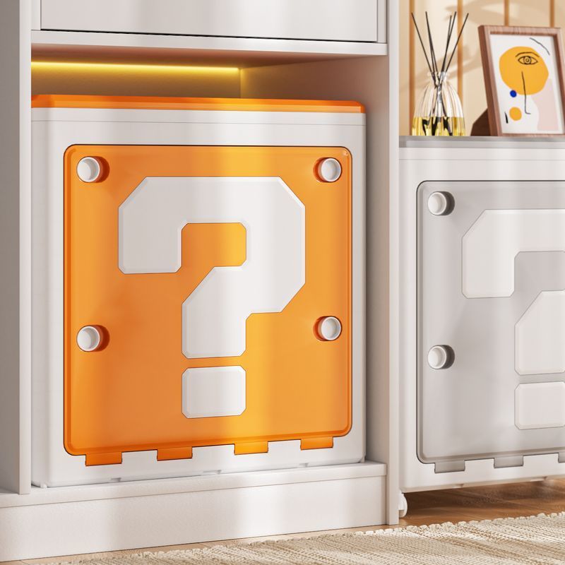 Decorative wall art resembling a question mark block from a video game, placed on a white surface.