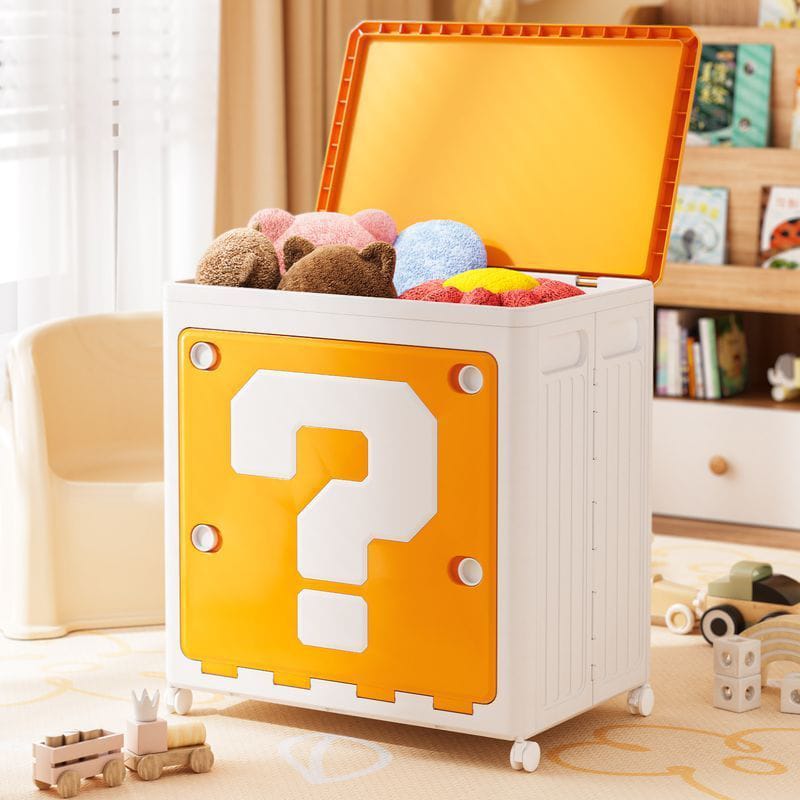 Toy storage box with a question mark design, filled with toys, in a room setting.