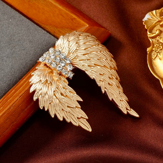 Celestial Gold Wing Brooch – Regal Crystal-Embellished Angel Wings in Dull Gold Finish | Luxury Statement Brooch for Distinguished Styling