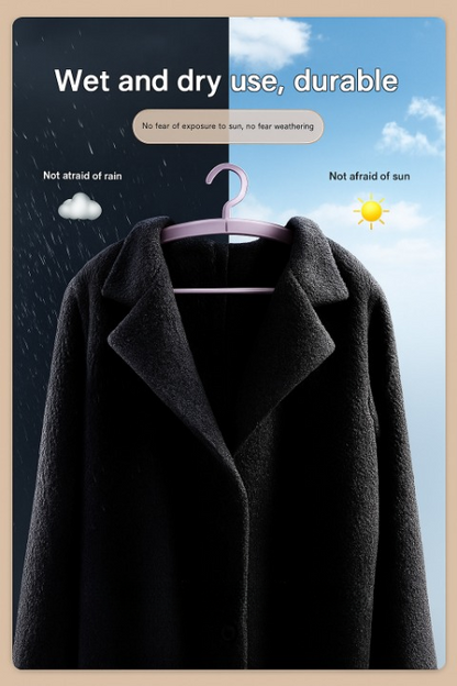 Black coat on a hanger with text about durability and weather resistance.