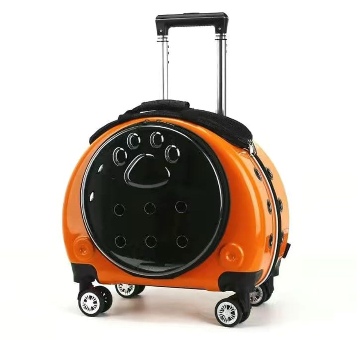 Orange suitcase with black circular design on a white background