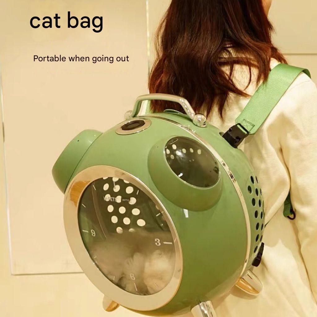 Green pet carrier backpack with a person wearing it, labeled 'cat bag'.