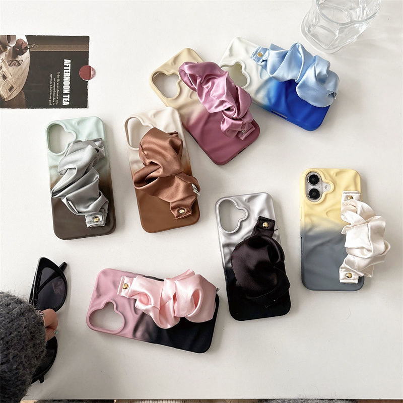 Collection of colorful phone cases on a white surface