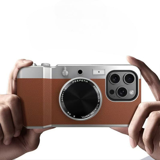 Person holding a smartphone with a vintage camera design case on a white background