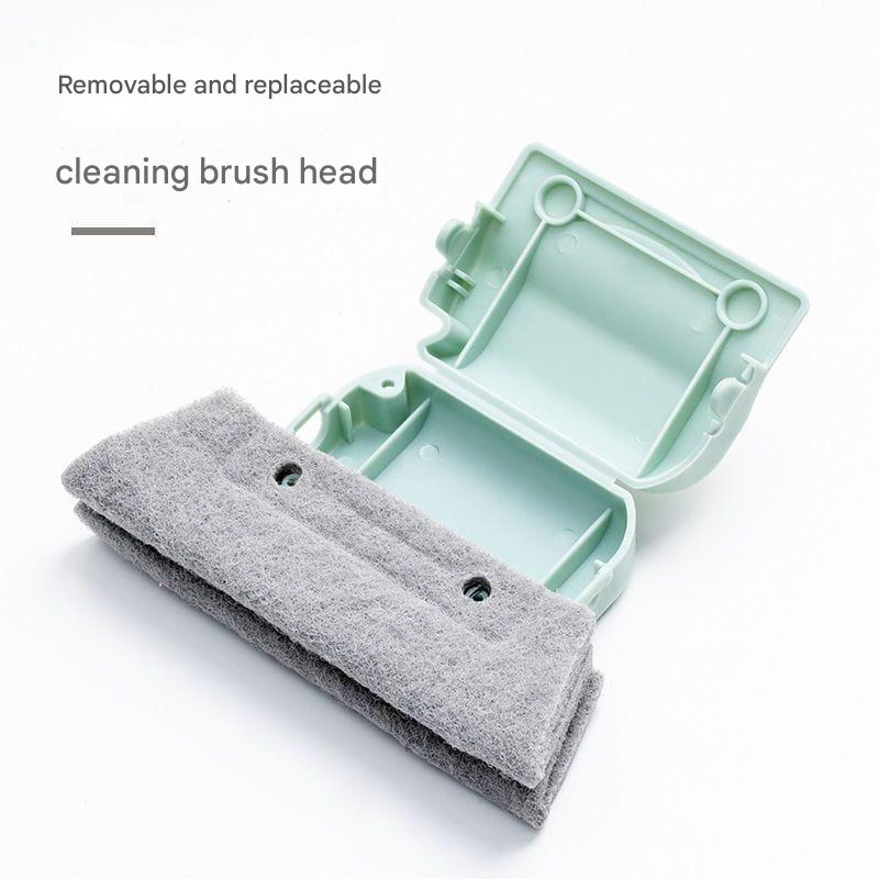 Gray cleaning brush head with a green storage case on a white background