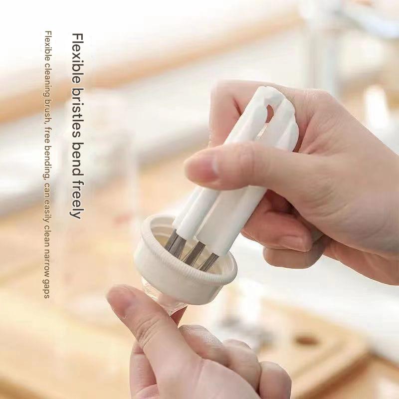 Hand holding a flexible cleaning brush with text on a blurred background