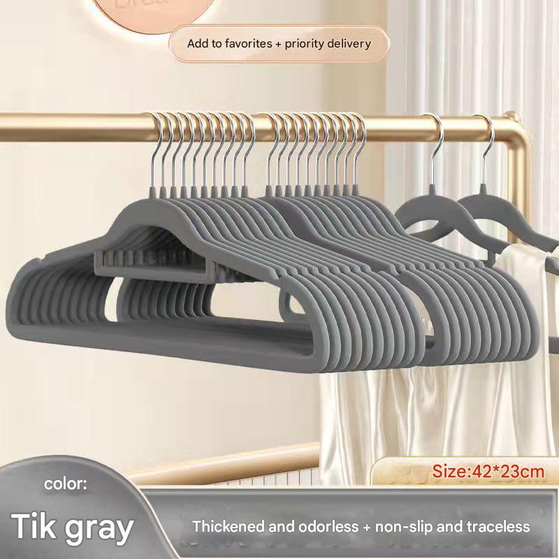 Set of gray hangers on a gold rack with text about product features and size.