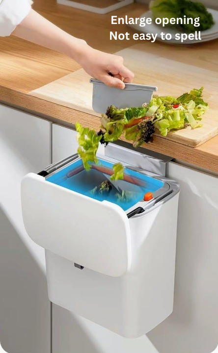 Kitchen compost bin with a person disposing of food waste into it.