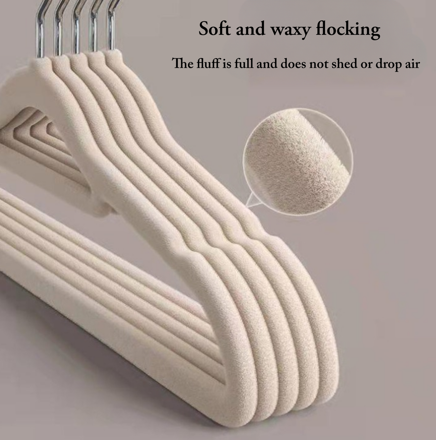 Set of beige hangers with text about soft and waxy flocking on a gray background