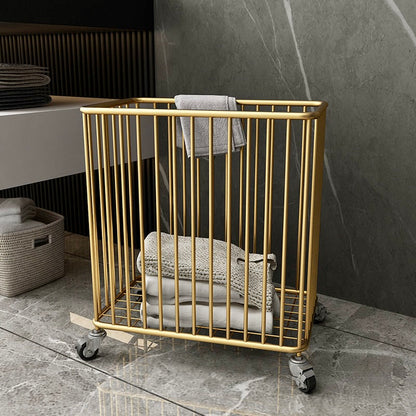 Gold metal towel rack with folded towels against a marble wall