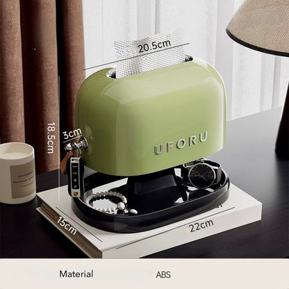 Green jewelry organizer with dimensions labeled on a table