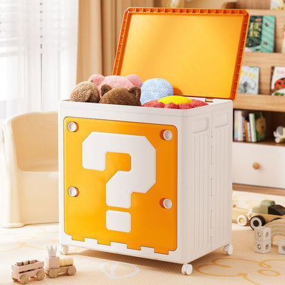 Toy storage box with a question mark design, filled with toys, in a room setting.