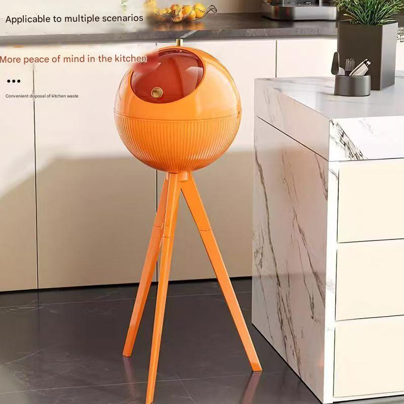 Orange kitchen trash bin on a kitchen floor with text about waste disposal.