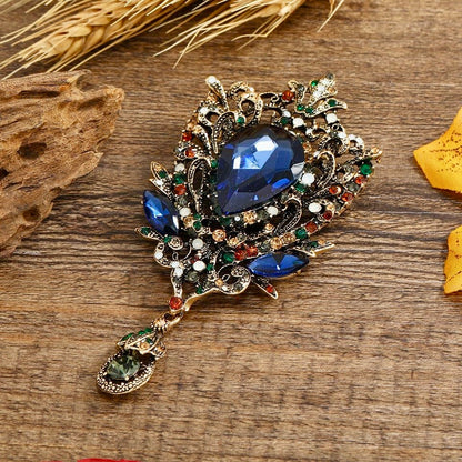 Opulent Crystal Statement Brooch – Exquisite Blue Teardrop Gem with Floral Crystal Detailing | Luxury Accent Brooch for Couture Styling