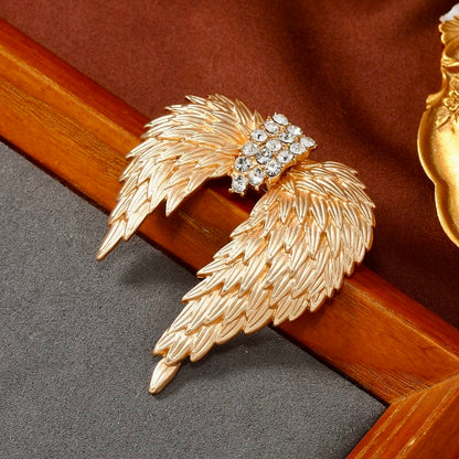 Celestial Gold Wing Brooch – Regal Crystal-Embellished Angel Wings in Dull Gold Finish | Luxury Statement Brooch for Distinguished Styling