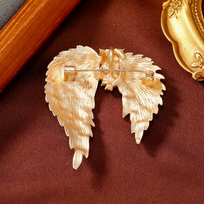 Celestial Gold Wing Brooch – Regal Crystal-Embellished Angel Wings in Dull Gold Finish | Luxury Statement Brooch for Distinguished Styling