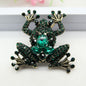 Emerald Sovereign Frog Brooch – Regal Crystal Emblem