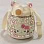 Decorative water bottle with gemstones and a bow on a light background